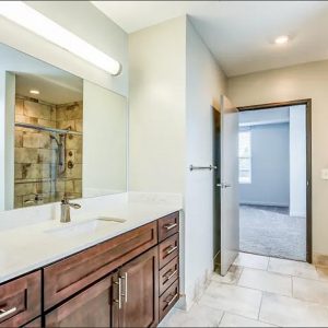 Model unit bathroom decorated in a modern style